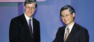 Akihito Otsuka shaking hands wth ?