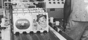 Man holding a crate of a carbonated nutritional drink
